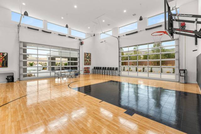 The Ridges home features an indoor basketball court as well as outdoor amenities like a covered ...