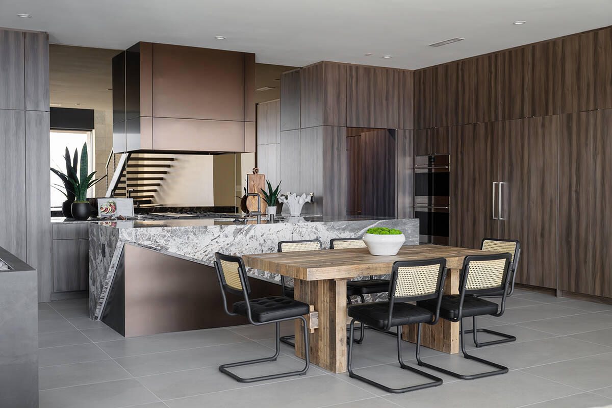 Arise in Ascaya features a kitchen with a large island. (Blue Heron Design/Build)