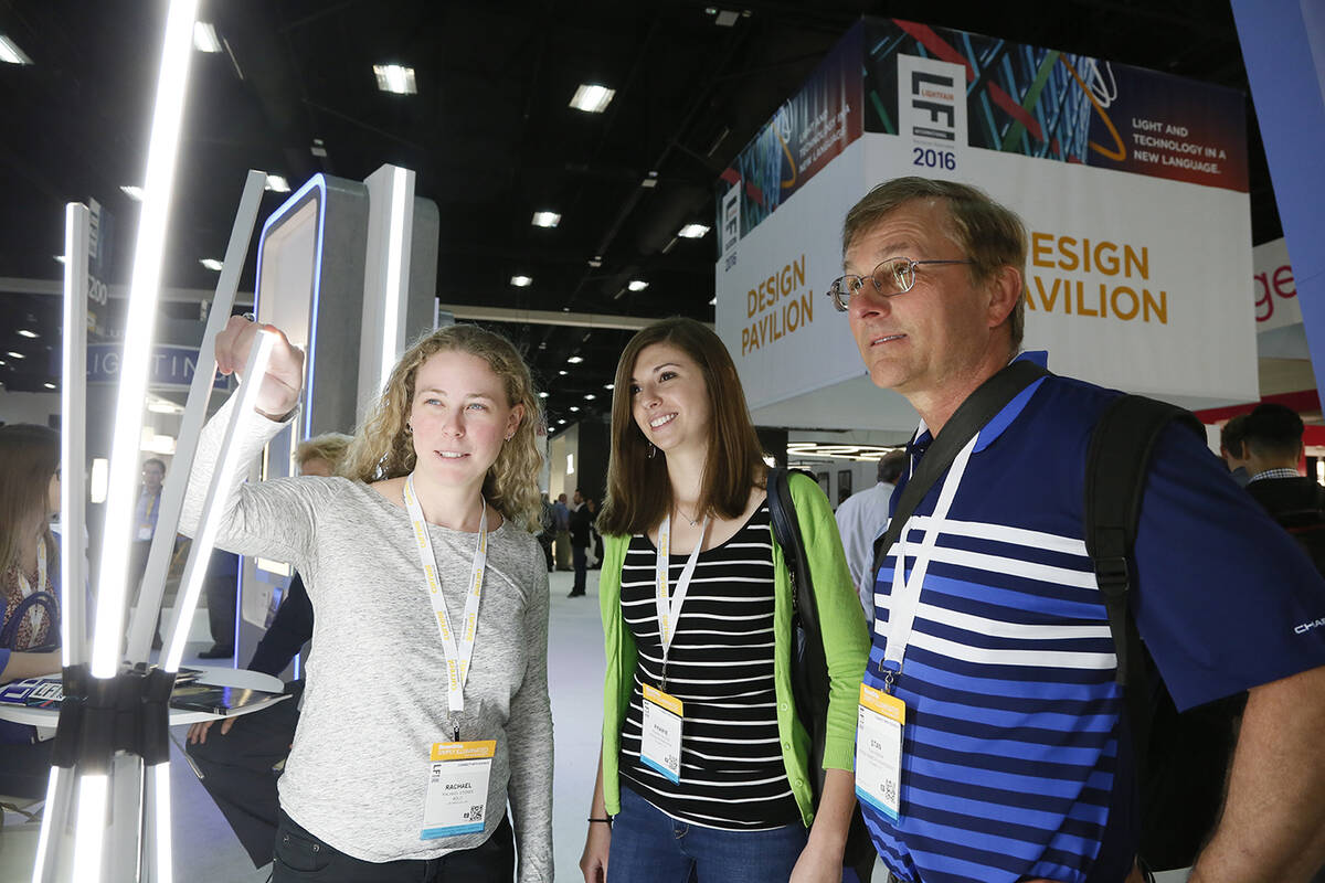 Convention-goers look at light displays at LightFair. (Photos courtesy of Messe Frankfurt North ...