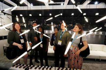 LightFair convention-goers look at futuristic light displays. (Photos courtesy of Messe Frankfu ...