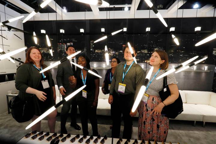 LightFair convention-goers look at futuristic light displays. (Photos courtesy of Messe Frankfu ...