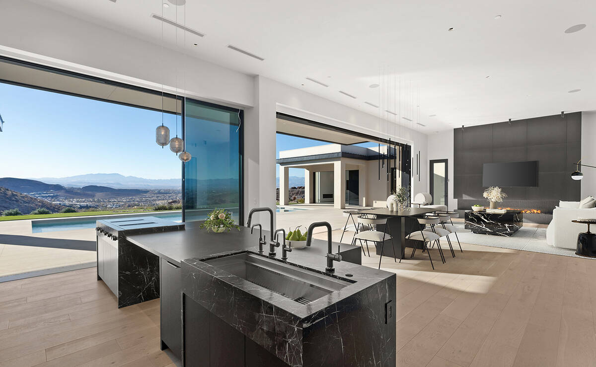 The MacDonald Highlands home includes seamless indoor-outdoor features with commanding panorami ...