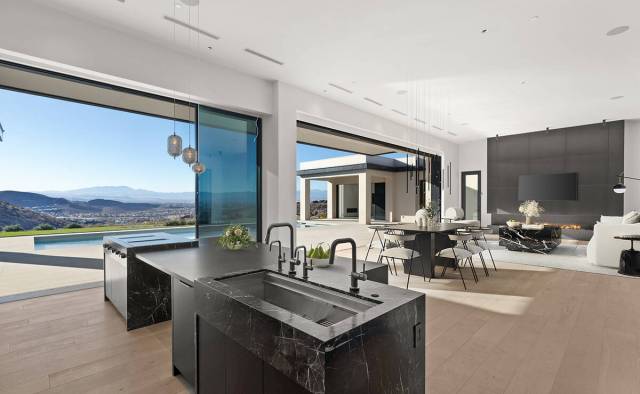 The MacDonald Highlands home includes seamless indoor-outdoor features with commanding panorami ...