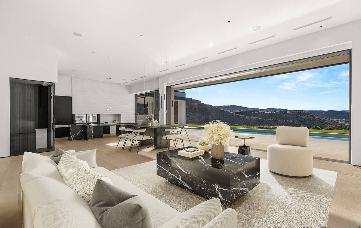 The golf-course mansion with sweeping views of the valley includes indoor/outdoor living featur ...
