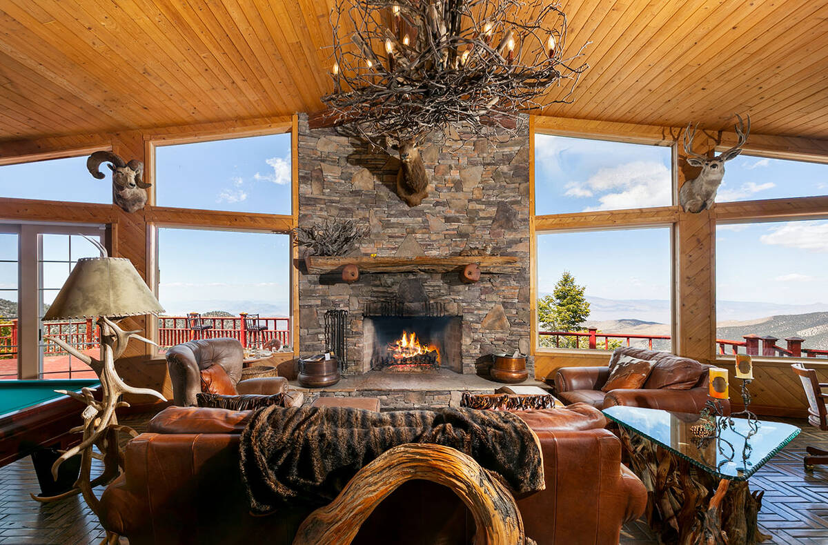 The large windows offer sweeping views of the pine tree forest. (IS Luxury)