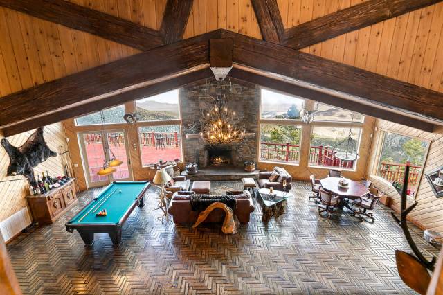 The property’s off-grid design features a solar power system with 24 solar panels and a 24-ba ...