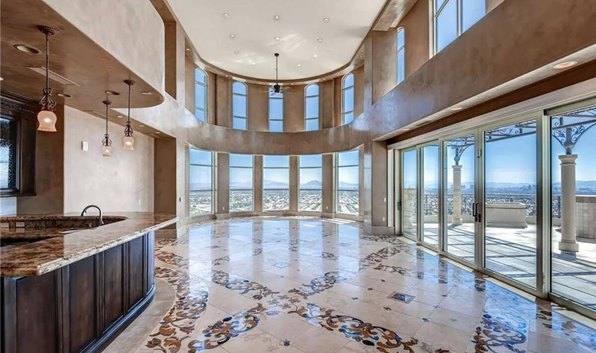 The One Queensridge Place penthouse features a 2,500 square-foot terrace with unobstructed Stri ...