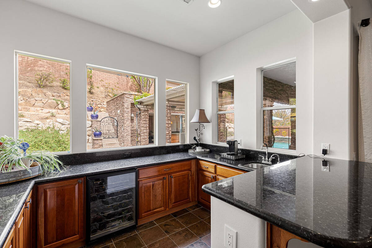 The kitchen has upgraded appliances. (Fraser Almeida, Luxury Homes Photography)