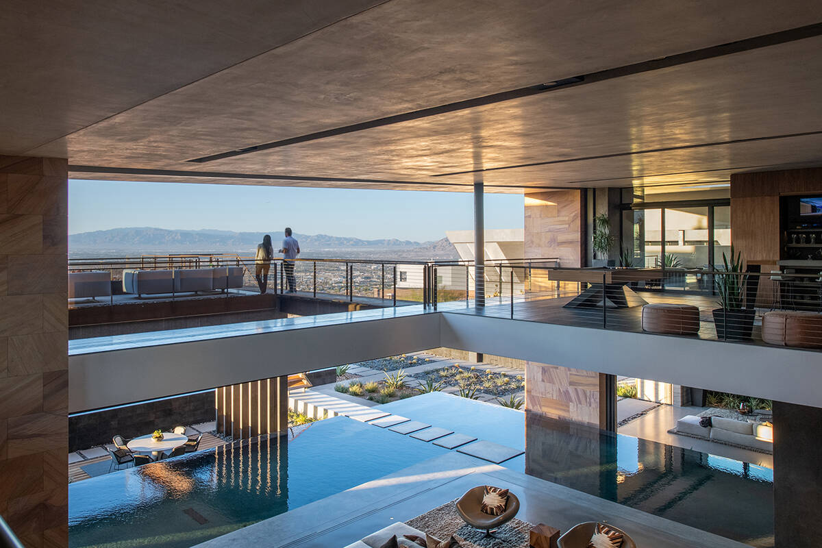 Home amenities include an executive office casita, digital den, glass-encased wine cellar, uppe ...
