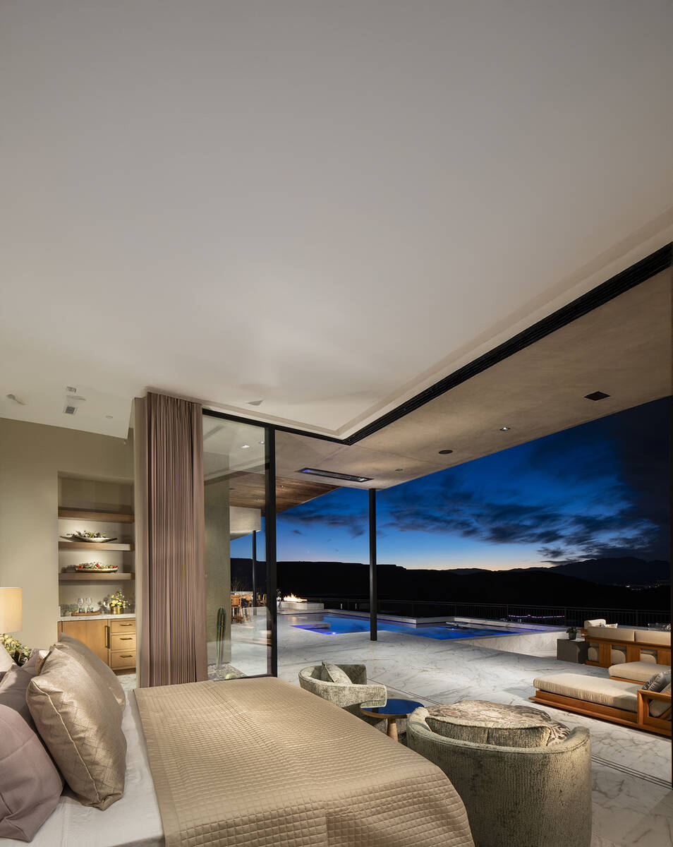 Sun West Custom Homes has utilized floor-to-ceiling glass pocket doors to integrate outdoor and ...