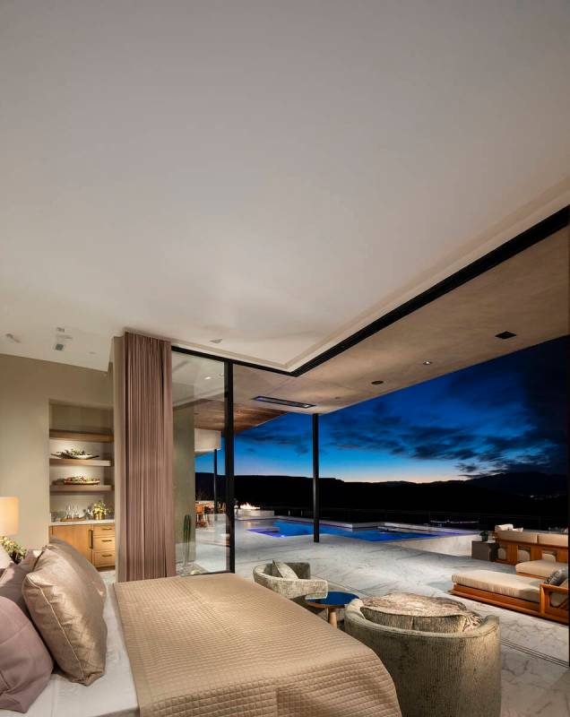 Sun West Custom Homes has utilized floor-to-ceiling glass pocket doors to integrate outdoor and ...