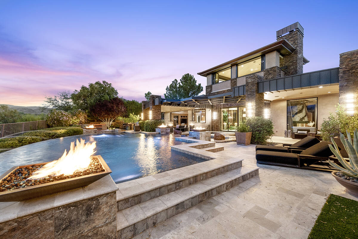 The two-story home measures 9,771 square feet with five bedrooms, seven baths and a five-car ga ...