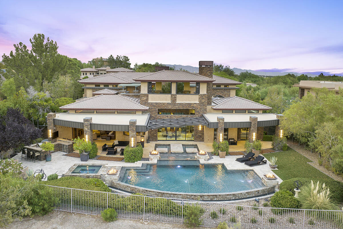 The first floor offers a sprawling great room, dining space, gourmet kitchen, owner’s suite, ...