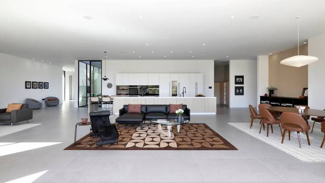 The home has soaring ceilings, floor-to-ceiling windows and automated pocket sliders for seamle ...