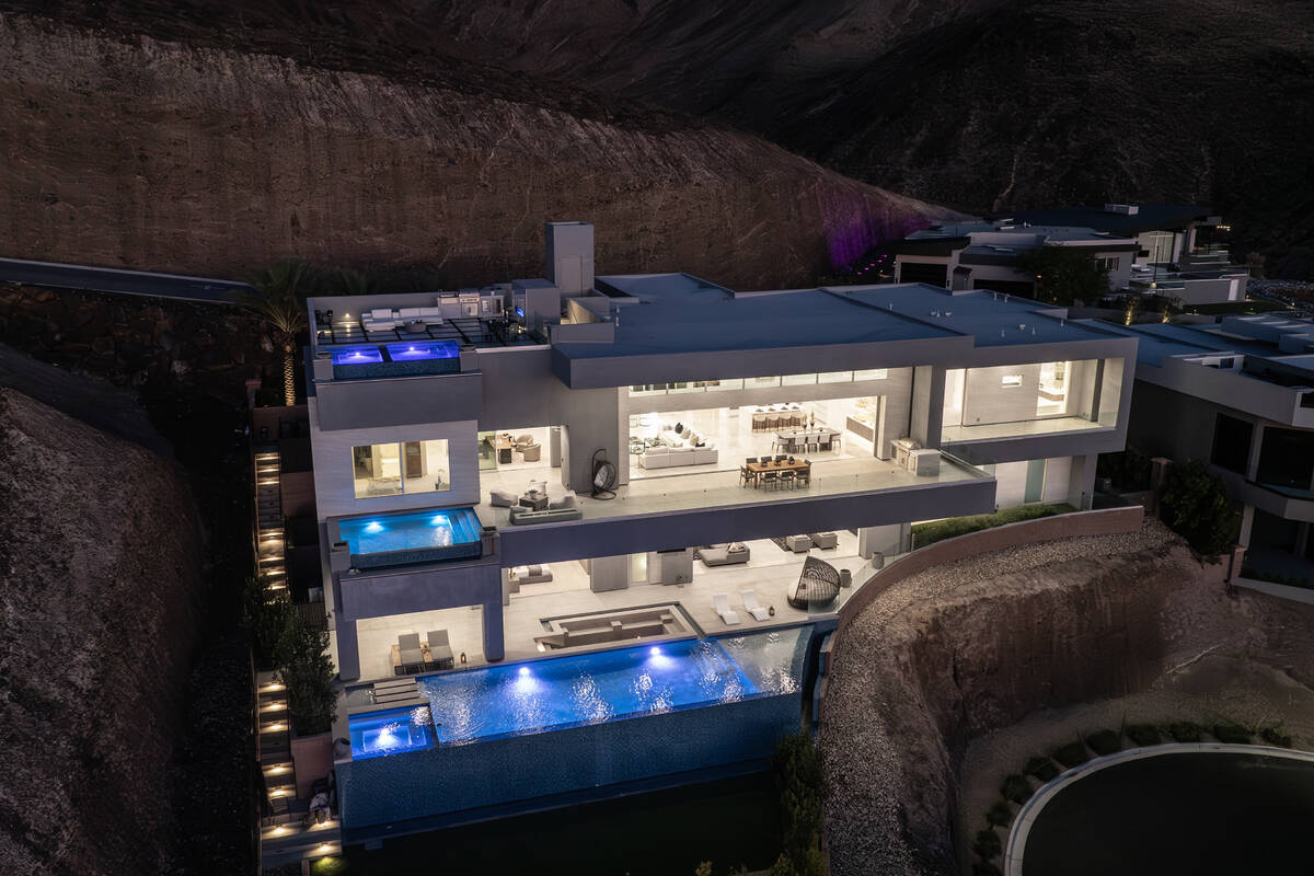 The mansion boasts three infinity-edge pools strategically positioned on separate floors. (Doug ...