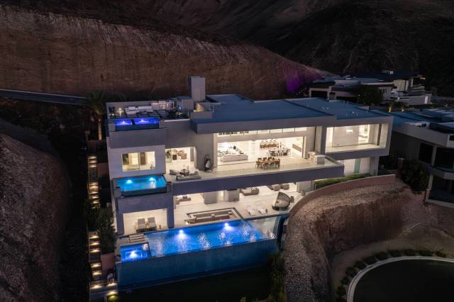 The mansion boasts three infinity-edge pools strategically positioned on separate floors. (Doug ...