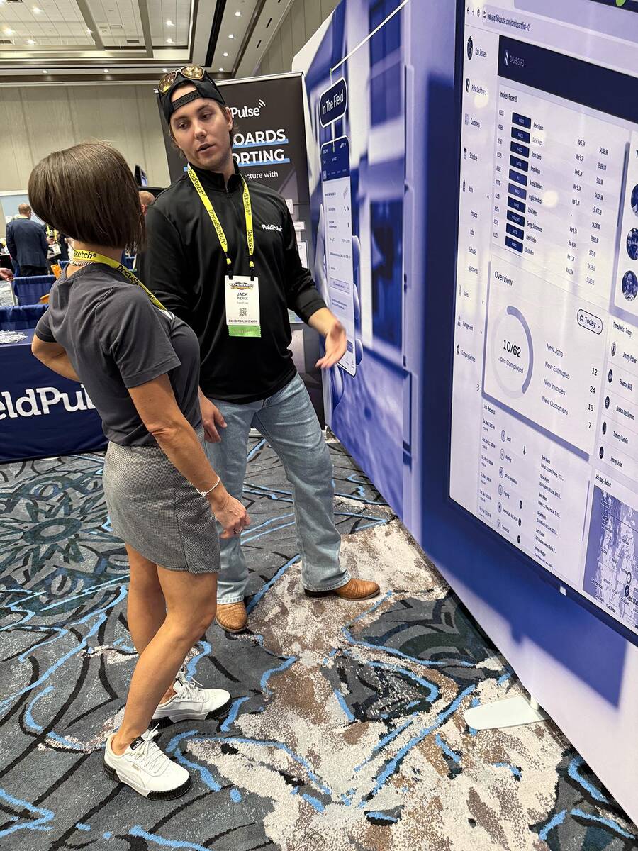 Beth Johnson, CEO of Absolute Flood Response, speaks with Jack Pierce, account executive for Fi ...