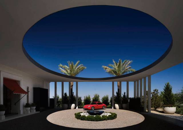 The home’s circular auto court is framed by a classical oculus structure over the driveway. ( ...