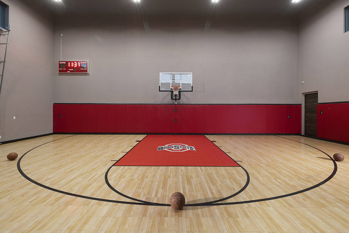 The home in Henderson's MacDonald Highlands features an indoor basketball court and other speci ...