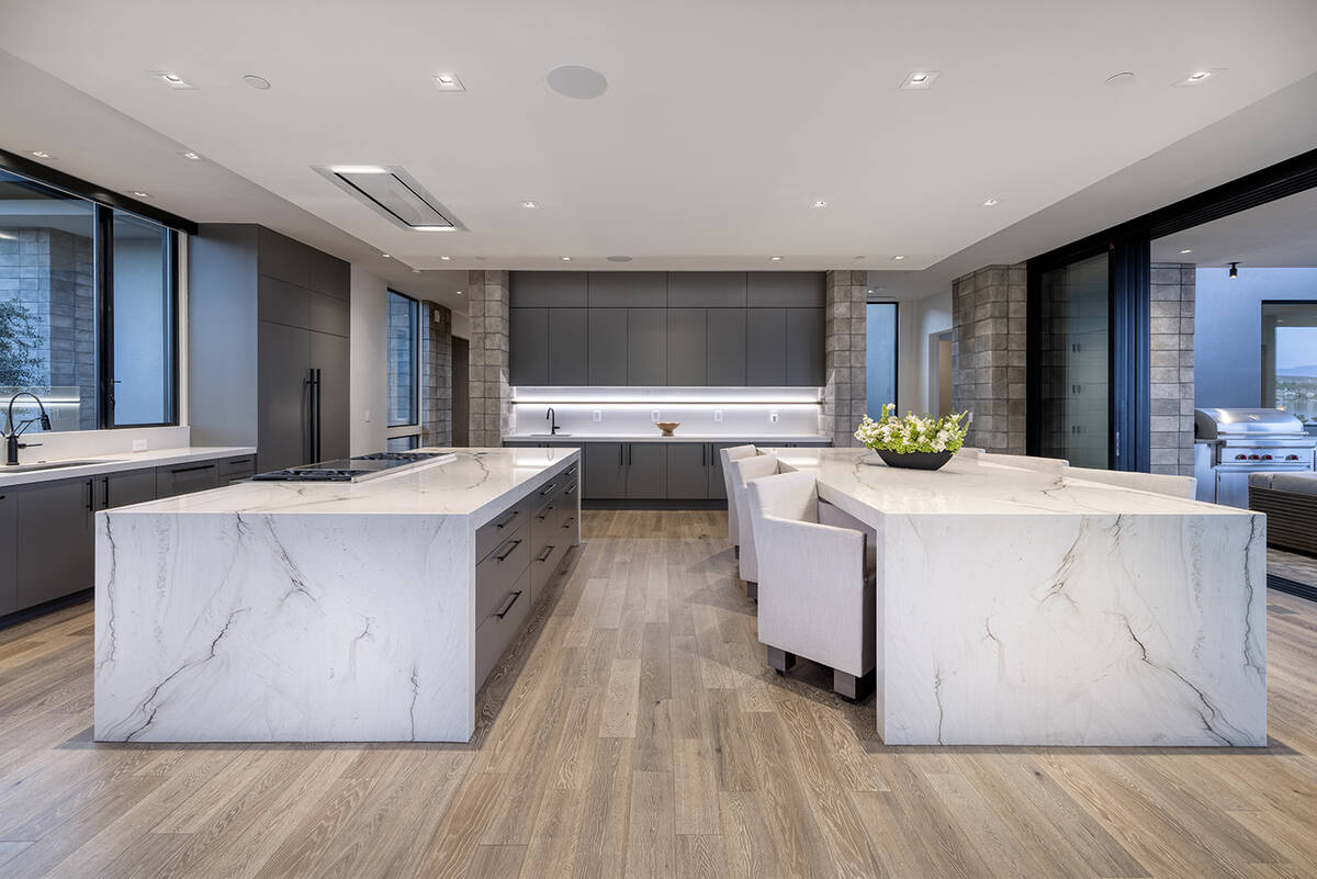 A compelling feature of the design is the contemporary kitchen. Bordering the great room, the c ...