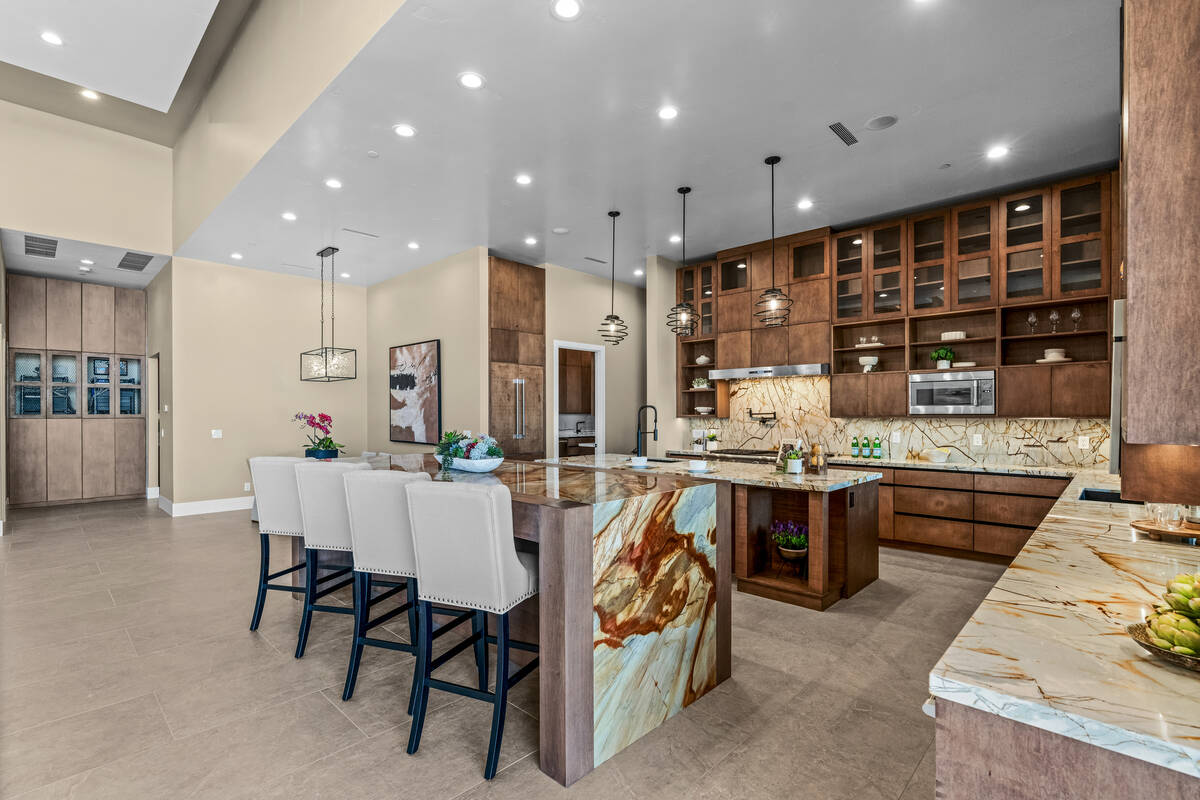 The kitchen is a showcase of luxury materials. The blending of materials and color, defined by ...